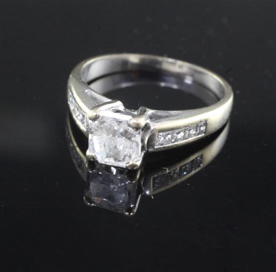 A modern 18ct white gold and single stone radiant? cut diamond ring, size O.